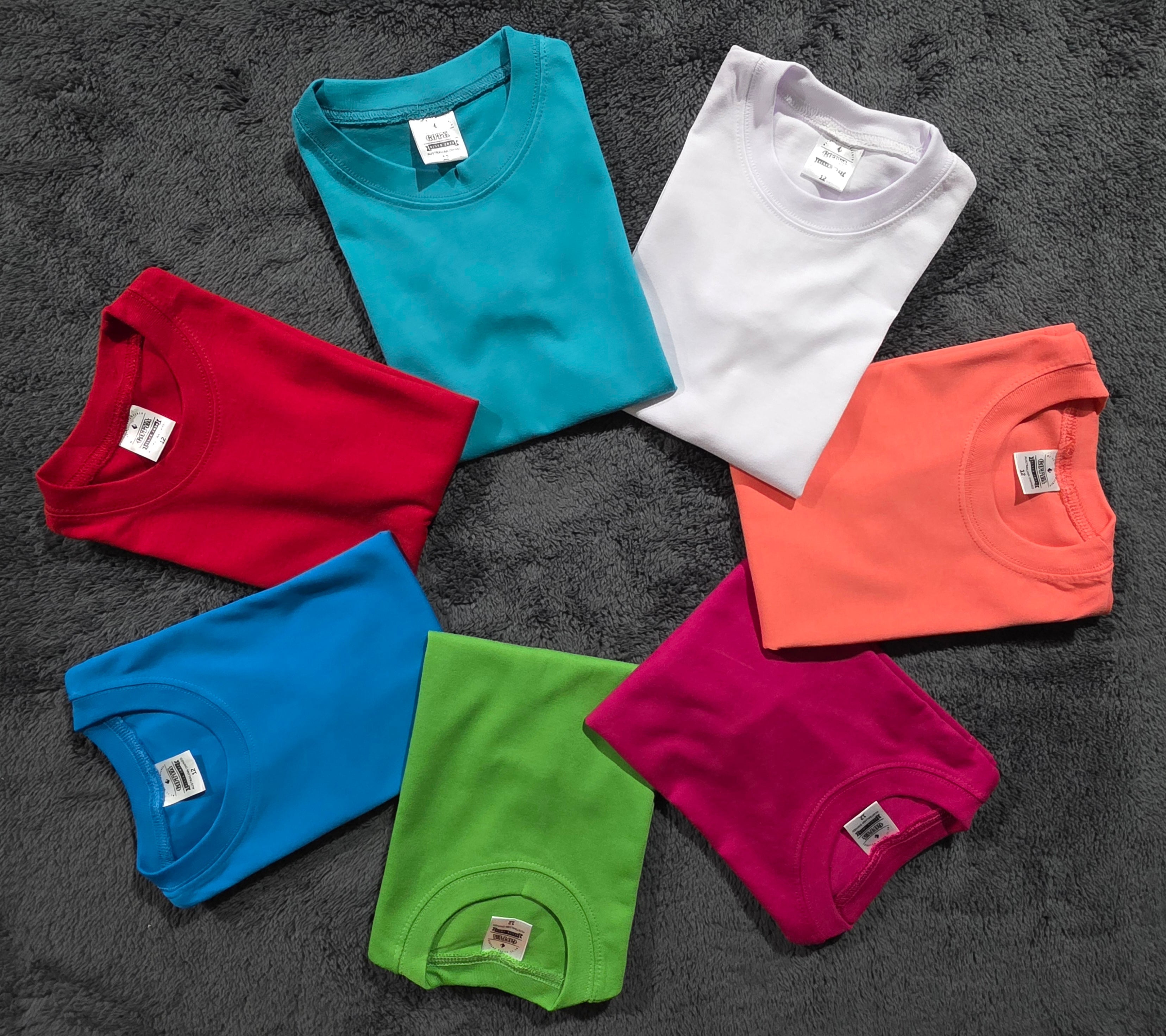 Kids combed cotton T-shirts in multiple bright colors, soft and durable 220GSM fabric, ideal for everyday wear and custom printing.