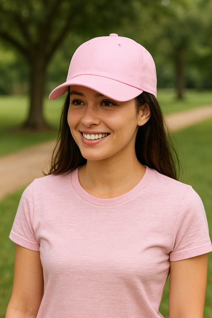 Woman wearing pink cotton twill baseball cap with adjustable strap outdoors
